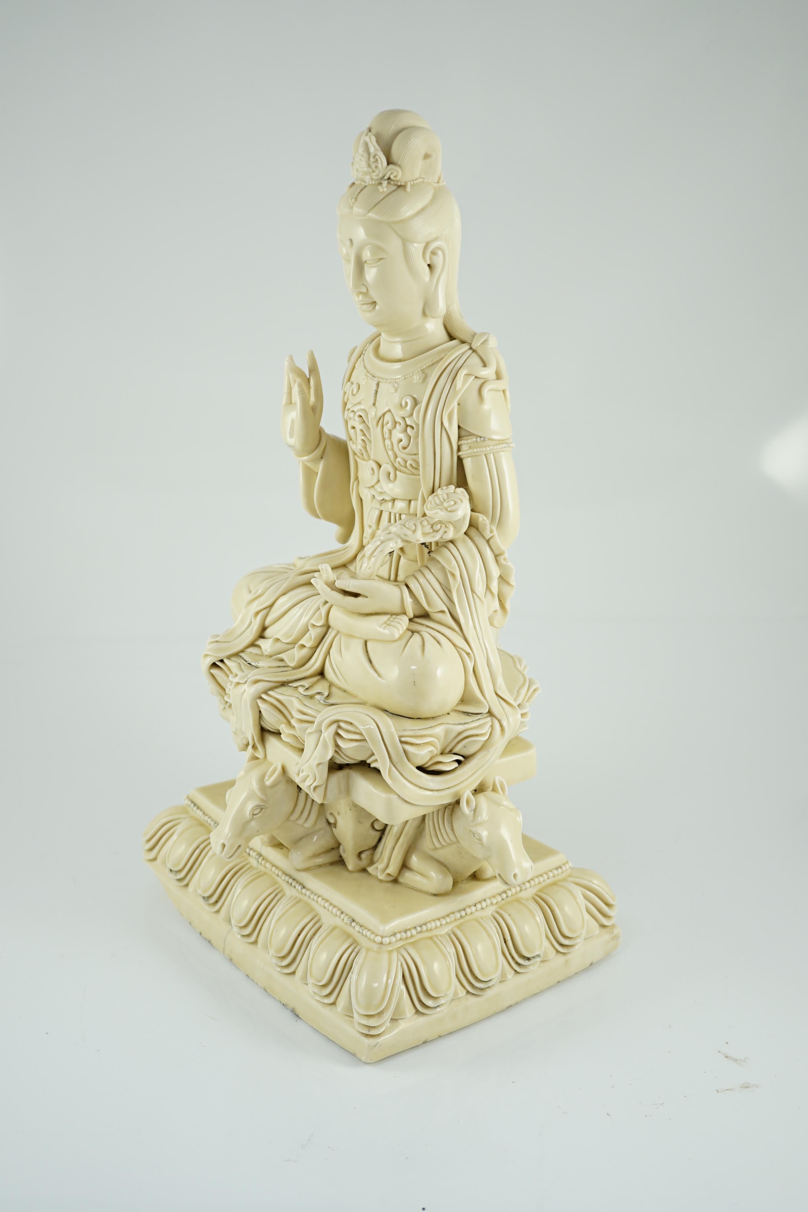 A large Chinese Dehua blanc de chine figure of Guanyin, Republic period, He Chaozong mark within a double gourd